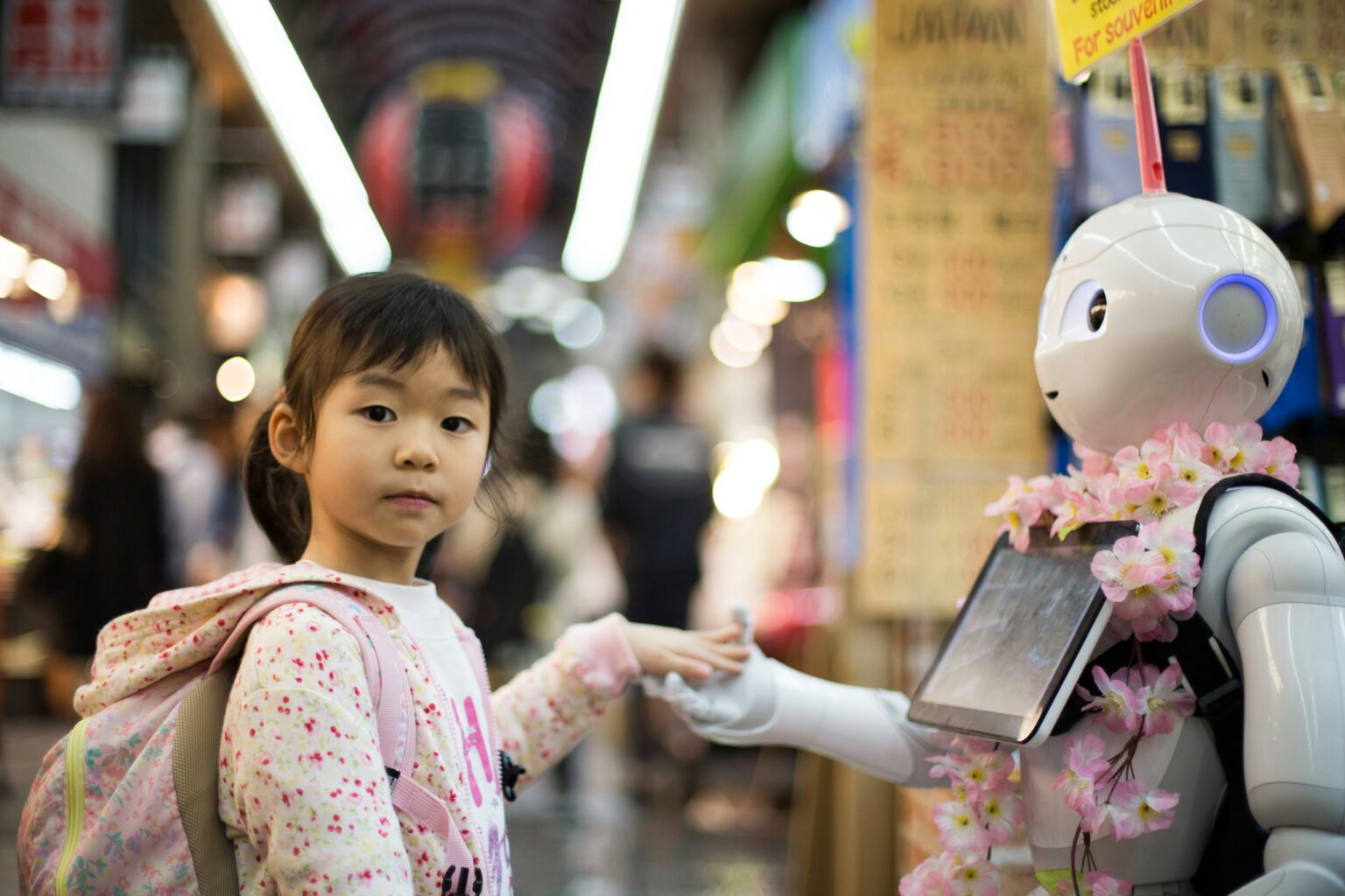 An image of a child and robot